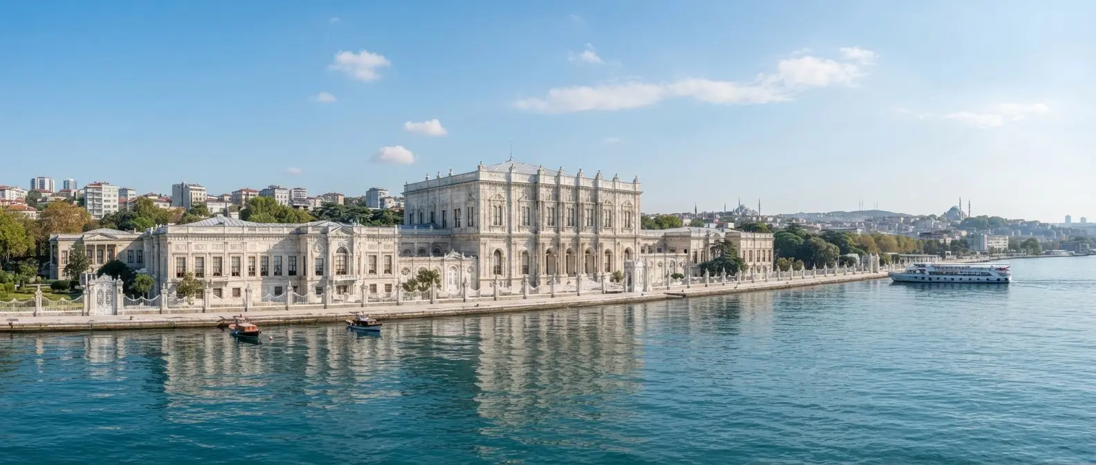 The waterfront facade stretching along the Bosphorus, reflected in calm water.